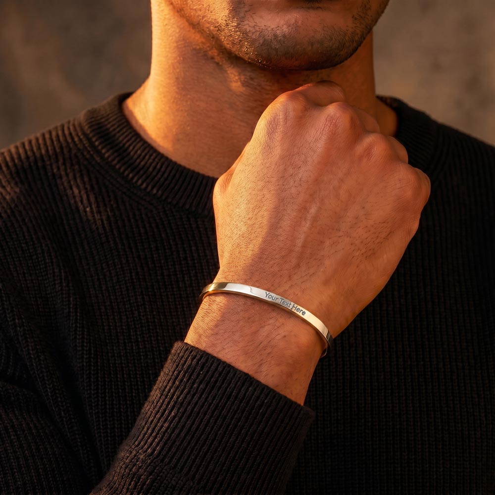 Man wearing the It's Still You engraved cuff bracelet